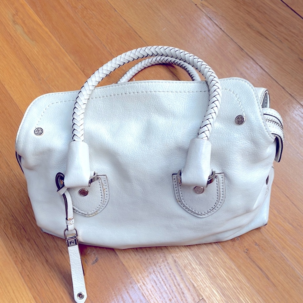 A pre-owned Cole Haan Ivory white leather purse bag magnetic top tassel charm.